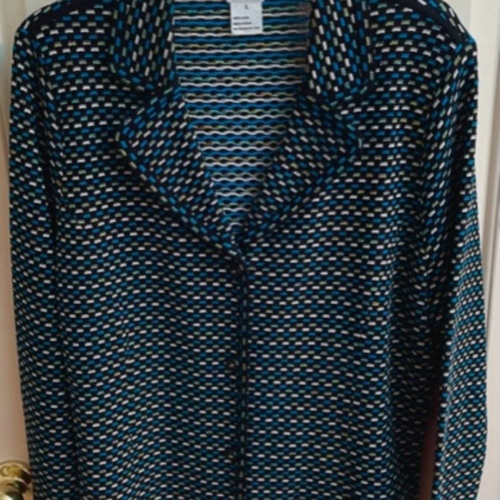 This versatile jacket can be worn as a companion to slacks or a dress.